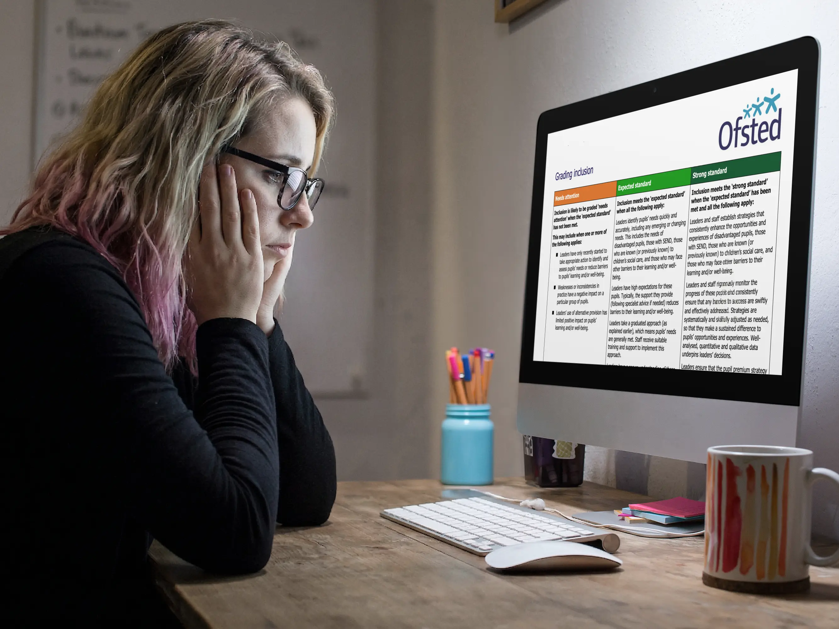 A stressed headteacher surrounded by inconsistent school improvement documents